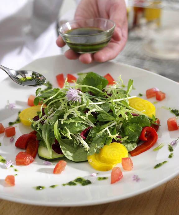 Photo of a chef in action, in the kitchen