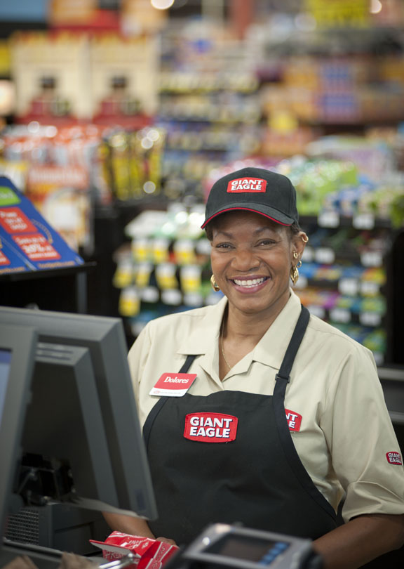 environmental portrait of worker in supermarket